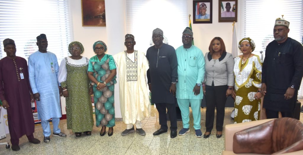 R-L The Executive Secretary of PTDF, Professor Shu'aibu Shehu Aliyu (6th) and the Ag. National Coordinator/CEO of the SERVICOM Office, Mrs. Helen Lawal (7th) in a group photograph with the management teams of the two Agencies during the courtesy visit/official inauguration of the Parastatal SERVICOM Unit and Committee (PSU/PSC) at the Fund’s Head Office in Abuja on 16th July, 2026.
