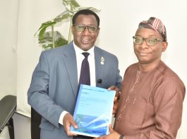 Director-General/CEO, Bureau of Public Procurement (BPP), Dr. Adebowale A. Adedokun, FCIPS, right, being presented with a copy of NIQS document by the President, Nigerian Institute of Quantity Surveyors (NIQS) Qs Dr. Aminu M. Bashir during their visit to the BPP in Abuja