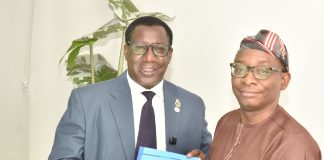 Director-General/CEO, Bureau of Public Procurement (BPP), Dr. Adebowale A. Adedokun, FCIPS, right, being presented with a copy of NIQS document by the President, Nigerian Institute of Quantity Surveyors (NIQS) Qs Dr. Aminu M. Bashir during their visit to the BPP in Abuja