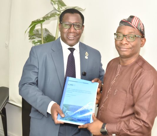 Director-General/CEO, Bureau of Public Procurement (BPP), Dr. Adebowale A. Adedokun, FCIPS, right, being presented with a copy of NIQS document by the President, Nigerian Institute of Quantity Surveyors (NIQS) Qs Dr. Aminu M. Bashir during their visit to the BPP in Abuja