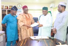 COREN Reaffirms Commitment to Strategic Collaboration with CORBON for Safer, More Sustainable Built Environment The Chairman of CORBON, Bldr. Samson Ameh Opaluwah (second left), presents a document to the President of COREN, Engr. Prof. Sadiq Zubair Abubakar, FNSE, FAEng, during the courtesy visit, as senior officials of both Councils look on.