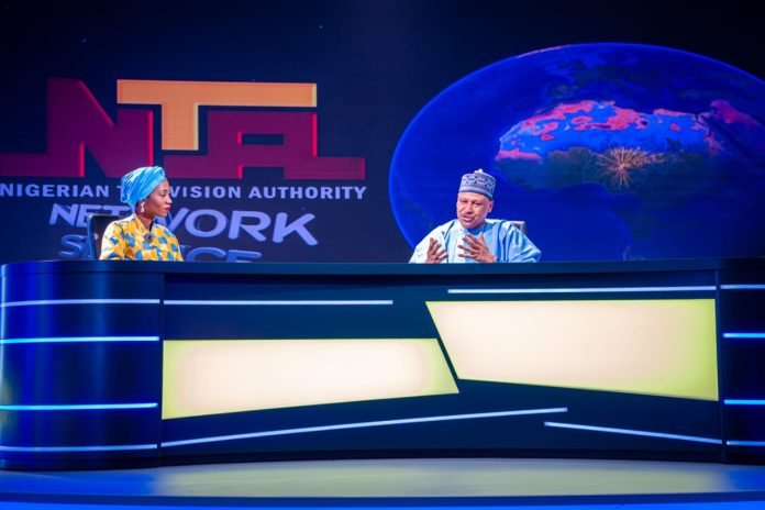 (L–R) Newscaster, Nigerian Television Authority (NTA), Ms. Ruth Aguele, interviews the Honourable Minister of Information and National Orientation, Mohammed Idris, fnipr, at the newly commissioned Network News Studio (Studio C) during the Honourable Minister's inspection visit to the NTA Headquarters on July 27, 2026, in Abuja. Photo: Khalid Ahmed/FMINO.