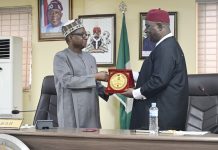 RMAFC, NOUN Explore Strategic Partnership TO Advance Fiscal Research, Digital Capacity Building And Remuneration Reforms L–R: RMAFC Chairman, Dr. Mohammed Bello Shehu, OFR, presents a souvenir to the Vice Chancellor of the National Open University of Nigeria (NOUN), Dr Oduma Orji Oduma, during the courtesy visit to the Commission.