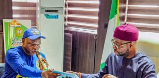 The Honourable Minister of Humanitarian Affairs and Poverty Reduction. Dr. Bernard M Doro received the draft Memorandum of understanding from the Executive Secretary NCPWD Mr Ayuba Burki when the later paid him a courtesy visit in his office.