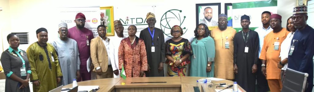 L-R, Head of the Reform Coordination and Service Improvement Unit (RCSIU)/NITDA's Nodal Officer, Mrs. Tariundu Ndoni (7TH), Representative of the Director General/Director of Digital Development Services, Mr. Oladejo Oluwumi (8TH), and the Ag. National Coordinator/CEO of SERVICOM Office Presidency, Mrs. Helen Lawal (9TH) in a group photograph with Management Teams of both Agencies during the Annual SERVICOM Parastatal Committee Workshop held on 24th August, 2026 at the NITDA Headquarters in Abuja under the theme “Every Role Matters - Delivering Quality Service Together,”