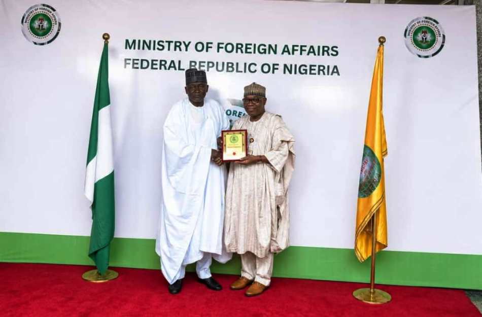 DG, NTAC, RT. HON. YUSUF BUBA YAKUB, PRESENTING A PLAQUE TO THE HON. MINISTER OF STATE FOR FOREIGN AFFAIRS, AMB. SOLA ENIKANOLAIYE, DURING THE NTAC VISIT, 30TH JULY 2026.