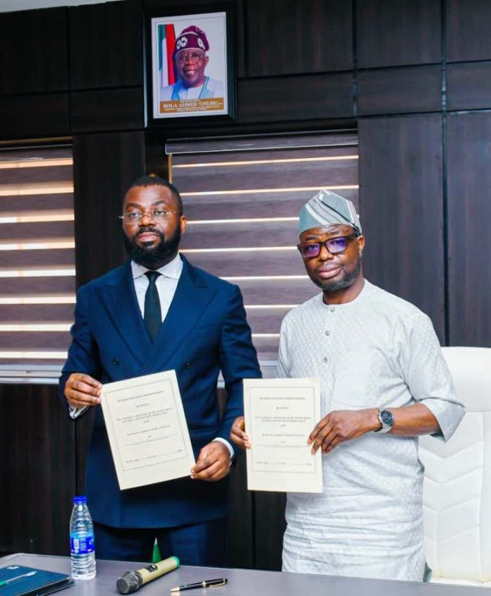 L-R : The Honourable Minister of Humanitarian Affairs and Poverty Reduction Dr Bernard M Doro and the Chief Executive Officer of Bank of Industry (BOA) Ayodeji Oludare when the latter visited the Honourable Minister in his office.