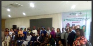 Group photo of government officials and Organised Private Sector operators with PEBEC delegation who participated in the Town Hall meeting.