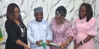 L-R; The Executive Director Administration Sama’ila Abdu, being assisted by the Ag. National Coordinator/CEO of the SERVICOM Office, Mrs. Helen Lawal (3rd), Board Secretary Chinelo Nwosu (1st) and Team ‘C’ Leader, Mrs. Kikelomo Aina (4th) during the unveiling of the Nigeria Social Insurance Trust Fund (NSITF) Local Service Charter, at the Fund’s Headquarters in Abuja on Tuesday August 4, 2026.