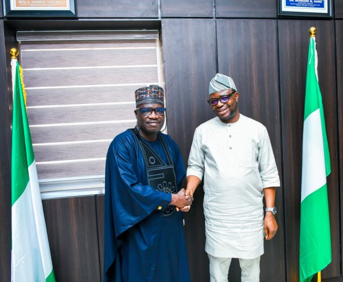 IMG-20260806-WA0150 R-L: The Honourable Minister of Humanitarian Affairs and Poverty Reduction. Dr Bernard M.Doro in a warm handshake with the Kaduna state Commissioner for Humanitarian Affairs. Comrade Yunana Markus Barde during the courtesy visit in the Honourable. Minister's office.