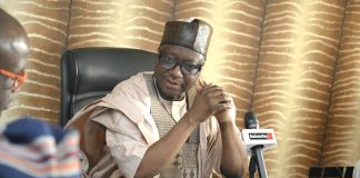 The Chairman of RMAFC listening to the MD's remarks