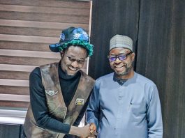 R- L : the Honourable Minister of Humanitarian Affairs and Poverty Reduction. Dr. Bernard M Doro in a handshake with the star IDP young man. OG Abbah when the delegation from IFON Youth Initiative visited the Minister in his office.