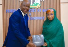 PS FMMBE Welcomes Strategic Financing Partnerships With Coronation Group To Accelerate Marine And Blue Economy Development The Permanent Secretary, Federal Ministry of Marine and Blue Economy, Mrs. Fatima Sugra Tabi’a Mahmood (right), receives a brochure highlighting the range of services offered by Coronation Group Limited from the company's Director, Government and Federal Capital, Mr. David Aluko, after a courtesy visit to the Ministry's in Abuja.