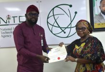 The Ag. National Coordinator/CEO of the SERVICOM Office, Mrs. Helen Lawal presenting ISO 9001 Lead Auditors Certificate to one of the successful members of staff, Oluwole Adegboyega Alao from the Corporate Communications and Media Relations Department during the Annual SERVICOM Parastatal Committee Workshop held on 24th August, 2026 at NITDA Headquarters in Abuja with the theme “Every Role Matters - Delivering Quality Service Together,”