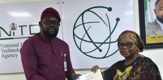 The Ag. National Coordinator/CEO of the SERVICOM Office, Mrs. Helen Lawal presenting ISO 9001 Lead Auditors Certificate to one of the successful members of staff, Oluwole Adegboyega Alao from the Corporate Communications and Media Relations Department during the Annual SERVICOM Parastatal Committee Workshop held on 24th August, 2026 at NITDA Headquarters in Abuja with the theme “Every Role Matters - Delivering Quality Service Together,”