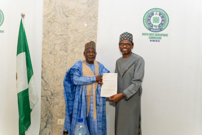 Bank of Industry Executive Director, Micro, Small and Medium Enterprises Mr. Oluwatoyin A. Edu, presenting a partnership proposal to the MD/CEO, NWDC Professor Shehu Abdullahi Ma'aji during a courtesy visit, Thursday in Kano.