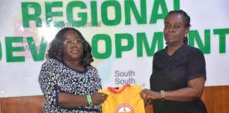L-R; The Head of SERVICOM Operations, Mrs. Ngozi Akinbodewa presenting awareness materials to the representative of the Permanent Secretary, Dr. Mary Ada Ogbe, the Director of Special Duties, Mrs. Gloria Inyangabasi, on behalf of the Ag. National Coordinator/ CEO of the SERVICOM Office Presidency, during the official inauguration of the Ministerial SERVICOM Unit and Committee (MSU/MSC) held on 17th August, 2026, at the Headquarters of the Ministry of Regional Development (MRD).