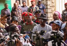 Minister's representatives- Director, Mines Inspectorate, Engr Imam Ganiyu(right), Director, Special Duties, Engr Frank Odom, (middle) and Commander, Mining Marshals, Attah Onoja listening to protester at the Ministry of Solid Minerals Development, Abuja on Thursday