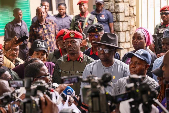 IMG-20260903-WA0063 Minister's representatives- Director, Mines Inspectorate, Engr Imam Ganiyu(right), Director, Special Duties, Engr Frank Odom, (middle) and Commander, Mining Marshals, Attah Onoja listening to protester at the Ministry of Solid Minerals Development, Abuja on Thursday