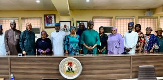 Middle: Representative of the RMAFC Chairman, Dr. Ekene Enefe in a group picture with stakeholders during the meeting at RMAFC HQ, Abuja.