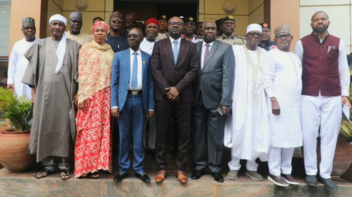 Members of the independent investigative Committee in a Group Photograph with the Hon Minister of Interior, Dr Olubunmi Tunji-Ojo, druing the inauguration.
