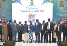 R – L, Director, Risk Management Department CBN, Dr. Blaise Ijebor (8th), Ag. National Coordinator/CEO of the SERVICOM Office, Mrs. Helen Lawal (9th) and Ag. Director, Special Duties CBN, Mr. Ishiaku Polycarp (10th) in a group photograph with other directors and other Management Staff during the celebration of the 2026 Customer Service Week at the bank headquarters in Abuja.