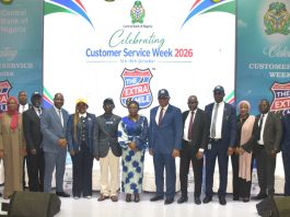 R – L, Director, Risk Management Department CBN, Dr. Blaise Ijebor (8th), Ag. National Coordinator/CEO of the SERVICOM Office, Mrs. Helen Lawal (9th) and Ag. Director, Special Duties CBN, Mr. Ishiaku Polycarp (10th) in a group photograph with other directors and other Management Staff during the celebration of the 2026 Customer Service Week at the bank headquarters in Abuja.