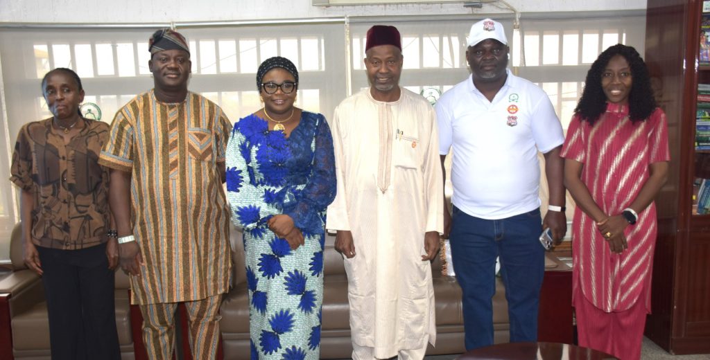 R – L, The Executive Secretary of National Universities Commission, Prof. Abdullahi Yusufu Ribadu (3rd) and the Ag. National Coordinator/CEO of the SERVICOM Office, Mrs. Helen Lawal (4th) in a group photograph with members of staff of both Agencies during the celebration at the Commission’s Headquarters in Abuja.