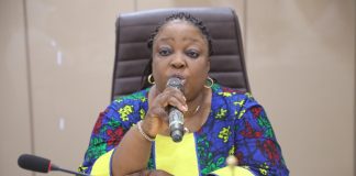 Representative of Permanent Secretary, Director Human Resource Management, Mrs Catherine Zozi delivery PS's speech during the event