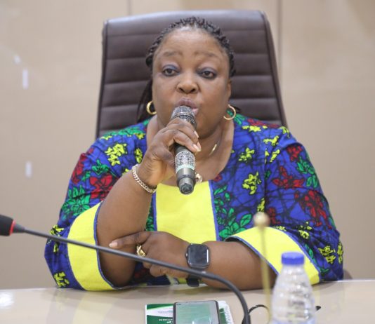 Representative of Permanent Secretary, Director Human Resource Management, Mrs Catherine Zozi delivery PS's speech during the event