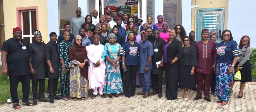 FRONT ROW; R-L, NAMA’S General Manager, SERVICOM/Customer Service, Mrs. Adepeju Ogunbanjo (7th), Ag. National Coordinator/CEO of the SERVICOM Office, Mrs. Helen Lawal (8th) and the representative of the Managing Director and Chief Executive, Engr. Farouk Ahmed Umar, the Director of Public Affairs and Consumer Protection Department, Mr. Musa Abdullahi in a group photograph with management, members of staff and staff from SERVICOM Office during the flag-off tour of the 2026 International Customer Service Week celebration at the Nigerian Airspace Management Agency (NAMA) on 6th October, 2026 in Abuja.