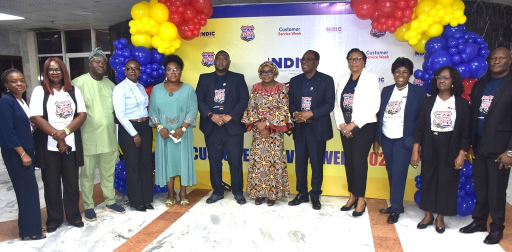 R-L; Executive Director of Corporate Services, Mrs. Emily Osuji (4th), the Managing Director and Chief Executive, Mr. Thompson Oludare Sunday (5th), Ag. National Coordinator/CEO of the SERVICOM Office, Mrs. Helen Lawal (6th) and the Executive Director of Operations, Dr. Kabir Sabo Katata (7th) in a group photograph with directors and Staff of SERVICOM Presidency during the Celebration of 2026 International Customer Service Week at the Nigeria Deposit Insurance Corporation (NDIC) on 8th October, 2026 in Abuja.