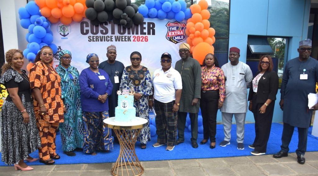 R – L, SERVICOM Head of Operations, Mrs. Ngozi Akinbodewa (6th) and the Ag. National Coordinator/CEO of the SERVICOM Office, Mrs. Helen Lawal (7th) in a group photograph with management and staff of the Nigerian Maritime Administration and Safety Agency (NIMASA) during the celebration of the 2026 Customer Service Week on 12th October, 2026 in Abuja.