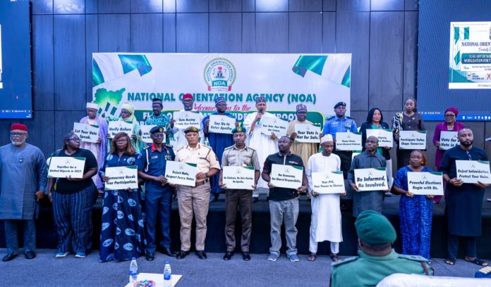 IMG-20261015-WA0057 *FLAG-OFF OF NATIONWIDE GRASSROOTS MOBILISATION FOR THE 2027 GENERAL ELECTION* The Honourable Minister of Information and National Orientation, Mohammed Idris, fnipr, alongside the Director-General of the National Orientation Agency (NOA), the Chairman of the Independent National Electoral Commission (INEC), Professor Joash Ojo Amupitan, SAN and other dignitaries, during the flag-off of the Nationwide Grassroots Mobilisation for the 2027 General Election on October 15, 2026, in Abuja. Photo: Khalid Ahmed/FMINO.