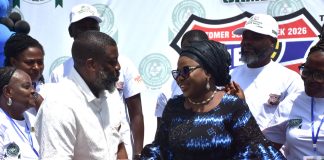 Ag. National Coordinator/CEO of the SERVICOM Office, Mrs. Helen Lawal in a ward handshake with the Registrar and Chief Executive of JAMB, Professor Segun Aina after his decoration as SERVICOM Champion during the Board’s commemoration of the 2026 Customer Service Week on 19th October, 2026 at the Headquarters of Joint Admissions and Matriculation Board (JAMB) in Abuja.