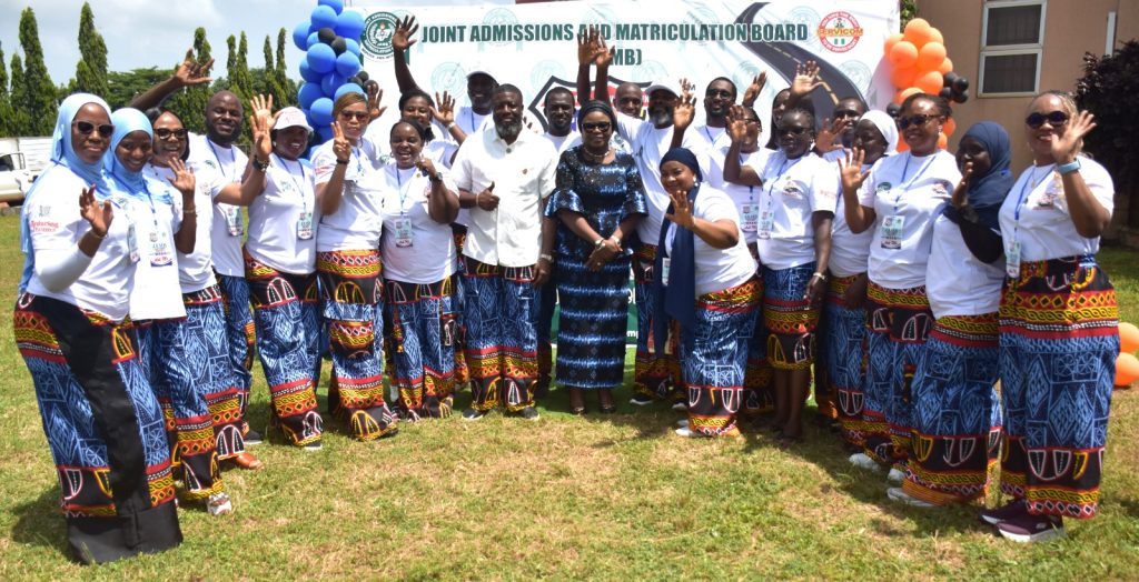 Ag. National Coordinator/CEO of the SERVICOM Office, Mrs. Helen Lawal and JAMB Registrar/Chief Executive, Professor Segun Aina in a group photograph with members of the SERVICOM Unit and Committee during the Joint Admissions and Matriculation Board (JAMB) commemoration of the 2026 Customer Service Week on 19th October, 2026 at the Board’s Headquarters in Abuja.