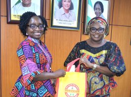 R – L; Ag. National Coordinator/CEO of the SERVICOM Office, Mrs. Helen Lawal presenting SERVICOM Awareness Materials to the Permanent Secretary Federal Ministry of Budget and Economic Planning, Mrs. Deborah Odoh after the latter was decorated as SERVICOM Champion during the official courtesy visit to the Ministry on 21st October, 2026 in Abuja.