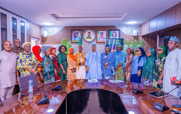 *COURTESY VISIT BY WOMEN OF INFLUENCE FOR TINUBU 2027* The Honourable Minister of Information and National Orientation, Mohammed Idris, fnipr, in a group photograph with the National Convener of Women of Influence for Tinubu 2027, Hauwa Farouk Ibrahim; Special Assistant on Administration to the Honourable Minister, Sunday Baba; Director of the Public Relations and Protocol Department (PRPD), Dr. Suleiman Haruna; Head of Protocol to the Honourable Minister, Oghenekevwe Uchendu; Chief Protocol Officer to the Honourable Minister, Sampson Ikemitang; and other members of the women’s political support group, following a courtesy visit on October 21, 2026, in Abuja. Photo: Khalid Ahmed/FMINO.