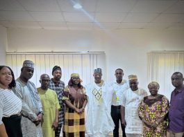 The Executive Director, NIWRMC, Dr. Abdulmumini Aminu Zaria (M), in a group phograph with the National Chairman, Nigeria Institute of Water Engineers, Engr. Temitope Aboyeji (L) and her team with the management staff of the Commission in Abuja.