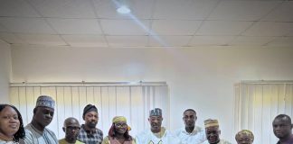 The Executive Director, NIWRMC, Dr. Abdulmumini Aminu Zaria (M), in a group phograph with the National Chairman, Nigeria Institute of Water Engineers, Engr. Temitope Aboyeji (L) and her team with the management staff of the Commission in Abuja.