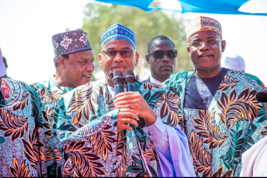 APC Candidate for Adamawa State governorship, Alh. Ahmed Tijjani Galadima is in this picture flanked by his running mate, Hon. Adamu Kamale and the DG of his campaign, Amb. Kevin Peters as he delivers a speech at the event.