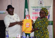 SERVICOM Head of Operations, Mrs. Ngozi Akinbodewa, presenting some Awareness Materials to the Permanent Secretary, Federal Ministry of Special Duties and Intergovernmental Affairs, Dr. Onwusoro Maduka I., during the inauguration of the newly appointed Ministerial SERVICOM Committee (MSC) members and the Permanent Secretary’s decoration as SERVICOM Champion at the Ministry’s Headquarters in Abuja on 29th October, 2026.