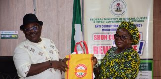 SERVICOM Head of Operations, Mrs. Ngozi Akinbodewa, presenting some Awareness Materials to the Permanent Secretary, Federal Ministry of Special Duties and Intergovernmental Affairs, Dr. Onwusoro Maduka I., during the inauguration of the newly appointed Ministerial SERVICOM Committee (MSC) members and the Permanent Secretary’s decoration as SERVICOM Champion at the Ministry’s Headquarters in Abuja on 29th October, 2026.