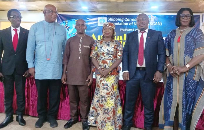 Representative of the Minister, Federal Ministry of Marine and Blue Economy, Director, Information & PR, Anastasia Ogbonna (4th left), President, Shipping Correspondents Association of Nigeria, Moses Ebosele (3rd left), Chairman of the Occasion, Temisan Omatseye (2nd left), Regional Manager, United Bank for Africa, Nelson Edoye (1st left), representative of Olisa Agbakoba, SAN, Akunne Nzube (5th left) & Director, Consumer Affairs, Nigerian Ports Economic Regulatory Agency, Ify Okolue.